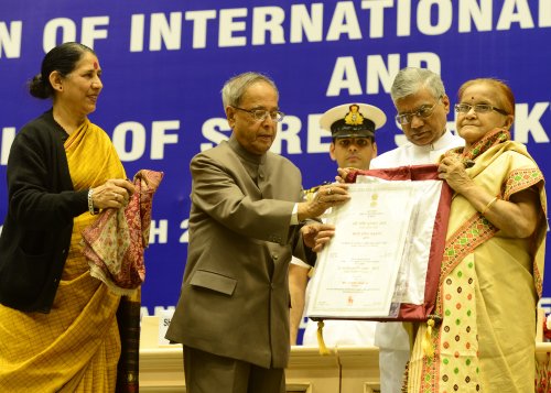 The President of India, Shri Pranab Mukherjee while Presenting the Stree Shakti Puruskar for the Year 2012 on the occassion of International Women's Day at Vigyan Bhawan in New Delhi on March 8, 2013. Also seen is the Union Minister of State (Independent
