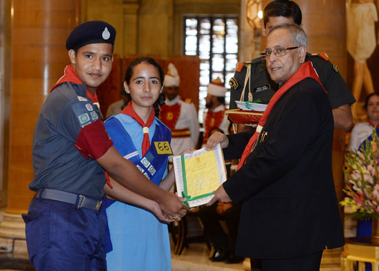 The President of India, Shri Pranab Mukherjee while presenting a Rashtrapati Scouts Award for the year 2010 and 2011 to the scouts at the Durbar Hall of Rashtrapati Bhavan in New Delhi on September 9, 2013.