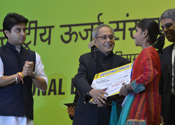 The President of India, Shri Pranab Mukherjee while presenting a National Energy Conservation Award at Vigyan Bhavan, New Delhi December 16, 2013 on the occasion of the National Energy Conservation Day. Also seen is the Minister of State for Power (Indepe